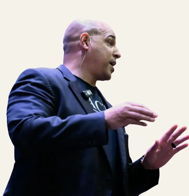 Anthony Young speaking on stage